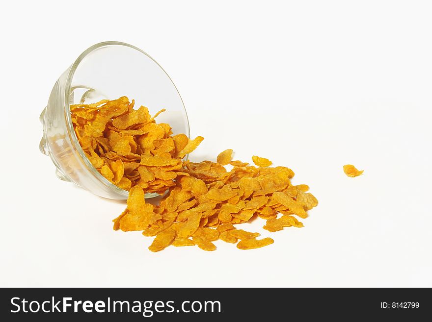 Cornflakes in a glass bowl. Cornflakes in a glass bowl