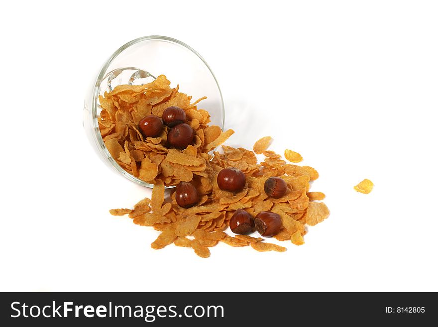 Cornflakes and nuts in a glass bowl. Cornflakes and nuts in a glass bowl