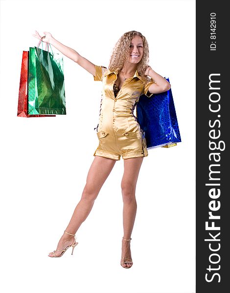 The young beautiful girl with purchases in colour packages during shopping on a white background. The young beautiful girl with purchases in colour packages during shopping on a white background