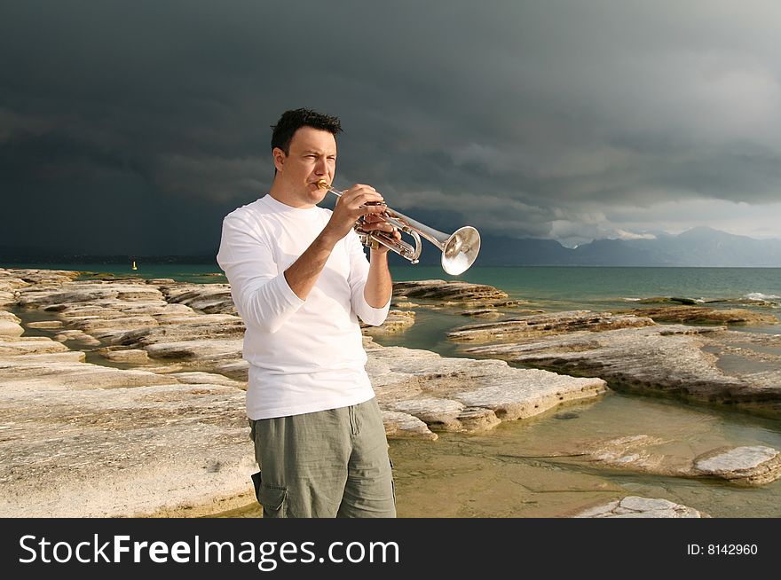 A man playing trumpet outdoor