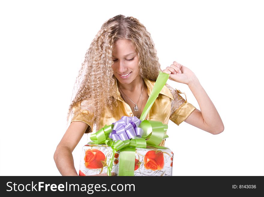 The young beautiful girl with a gift box on a white background. The young beautiful girl with a gift box on a white background