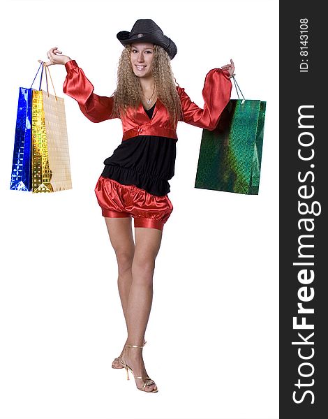 The young beautiful girl with purchases in colour packages during shopping on a white background. The young beautiful girl with purchases in colour packages during shopping on a white background