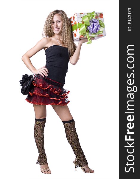 The young beautiful girl with a gift box on a white background. The young beautiful girl with a gift box on a white background