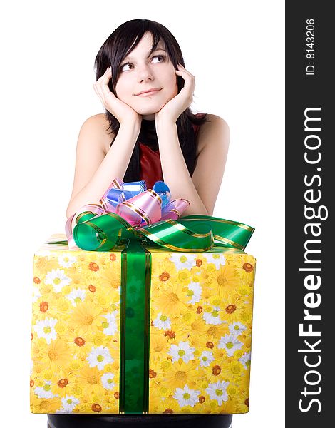 The young beautiful girl with a gift box on a white background. The young beautiful girl with a gift box on a white background