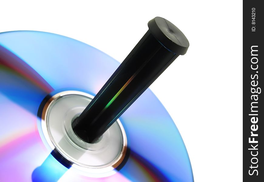 Close-up view of a blank recordable CD placed in a spindle tray isolated over white background (clipping path included). Close-up view of a blank recordable CD placed in a spindle tray isolated over white background (clipping path included)