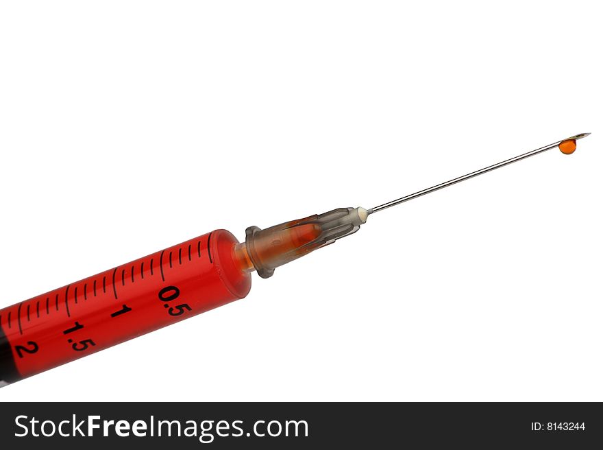 Syringe isolated on white with red liquid