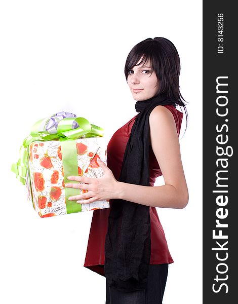 The young beautiful girl with a gift box on a white background. The young beautiful girl with a gift box on a white background