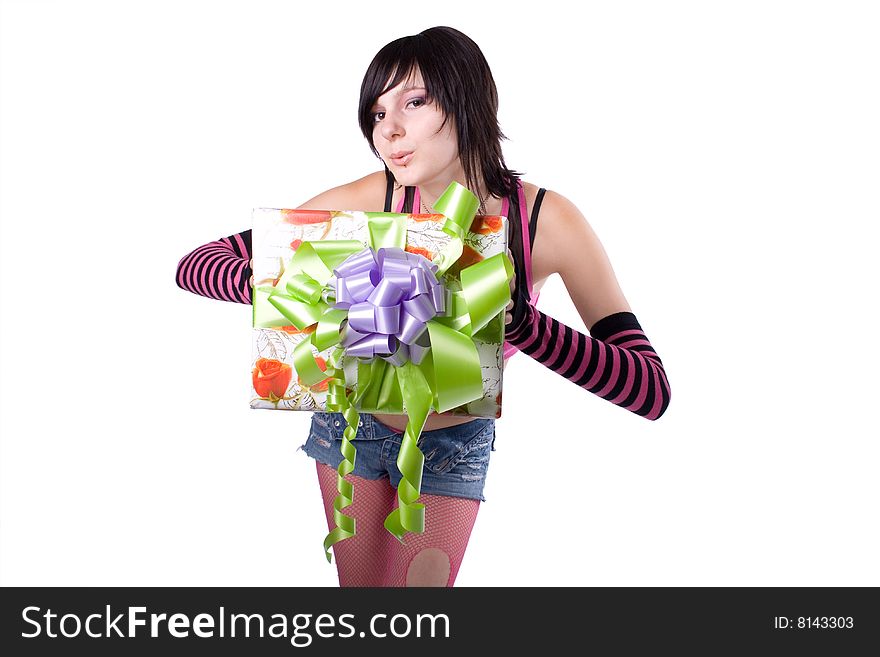 The young beautiful girl with a gift box on a white background. The young beautiful girl with a gift box on a white background