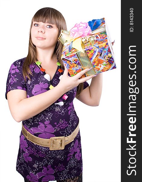 The young beautiful girl with a gift box on a white background. The young beautiful girl with a gift box on a white background