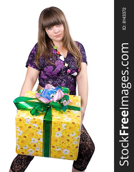 The young beautiful girl with a gift box on a white background. The young beautiful girl with a gift box on a white background