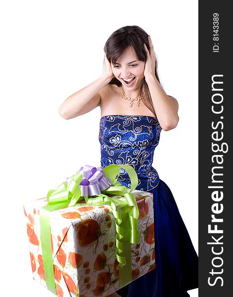 The young beautiful girl with a gift box on a white background. The young beautiful girl with a gift box on a white background