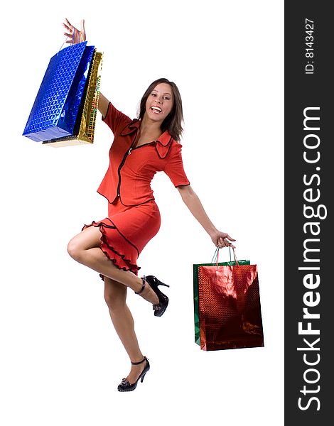 The young beautiful girl with purchases in colour packages during shopping on a white background. The young beautiful girl with purchases in colour packages during shopping on a white background