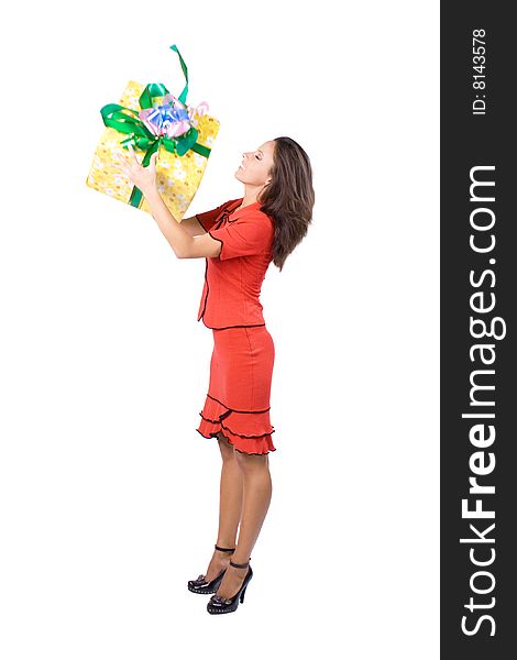 The young beautiful girl with a gift box on a white background. The young beautiful girl with a gift box on a white background