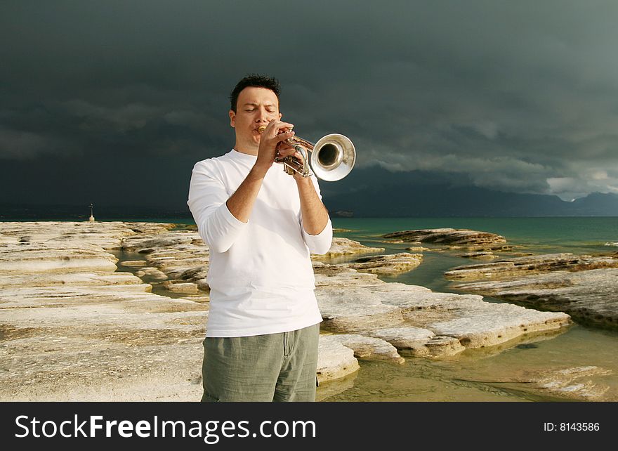 A man playing trumpet outdoor