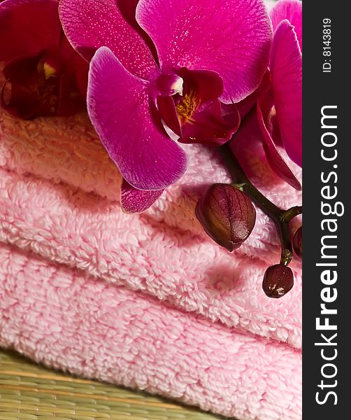 Towel with an orchid for rest