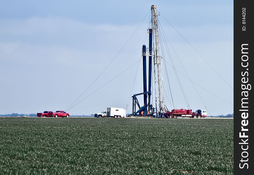 Pulling Unit in the middle of a winter wheat field pulling maintaince on an oil well