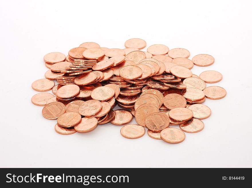 A pile of shiny cents, isolated on white. A pile of shiny cents, isolated on white