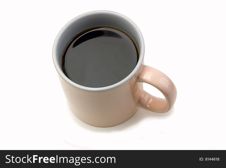 Salmon colored cup of black coffee. Salmon colored cup of black coffee