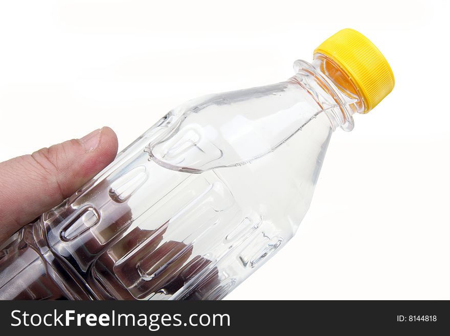 Holding a bottle of water on white.