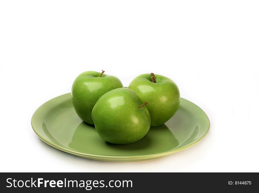 Three Granny Smith Green Apples on a plate with white background. Three Granny Smith Green Apples on a plate with white background