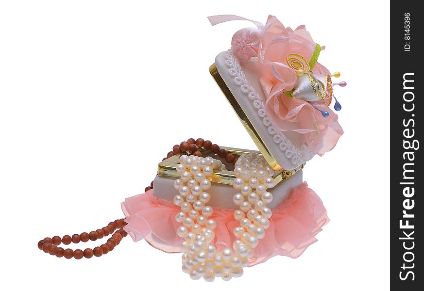 Open box with beads and pearls on a white background. Open box with beads and pearls on a white background.