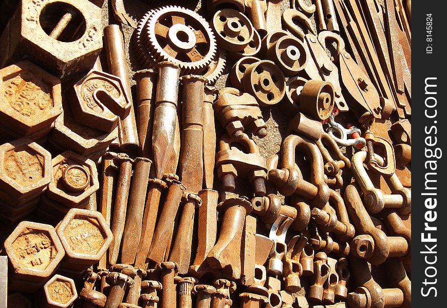 A background of rusty old hardware spare parts. A background of rusty old hardware spare parts