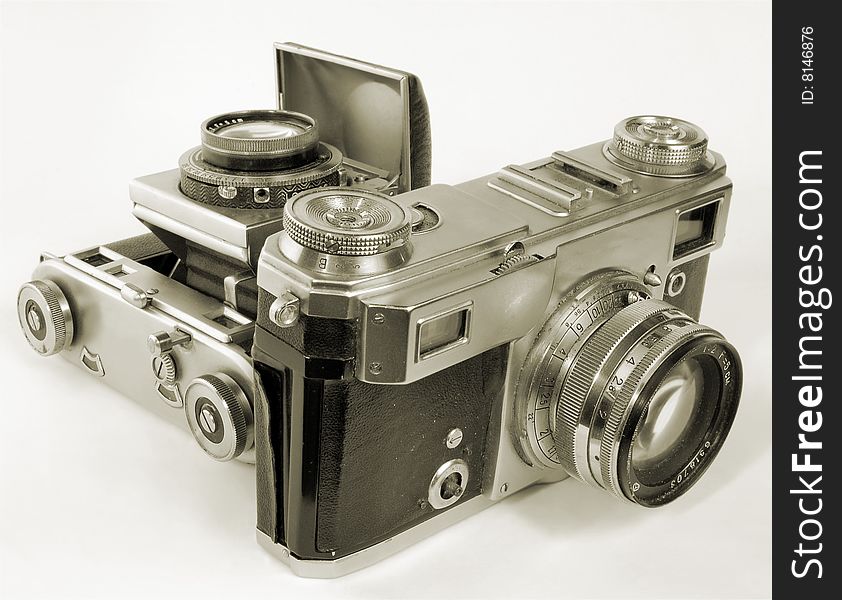 Two antiquarian 35-mm film cameras with put-forward lens. Two antiquarian 35-mm film cameras with put-forward lens.