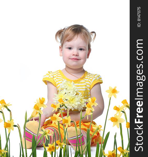 Funny little girl relaxing with yellow flowers. Funny little girl relaxing with yellow flowers