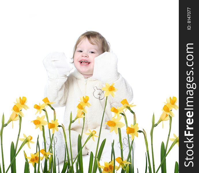 Funny little girl dressed in bear costume with yellow narcissus. Funny little girl dressed in bear costume with yellow narcissus