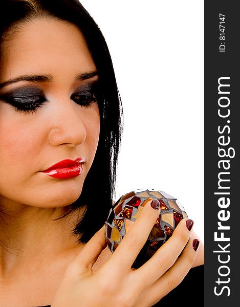 Portrait of woman looking the mirror ball on an isolated background