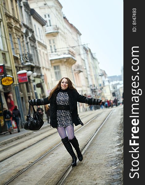 Stock photo: an image of a woman walking on railway in the city. Stock photo: an image of a woman walking on railway in the city