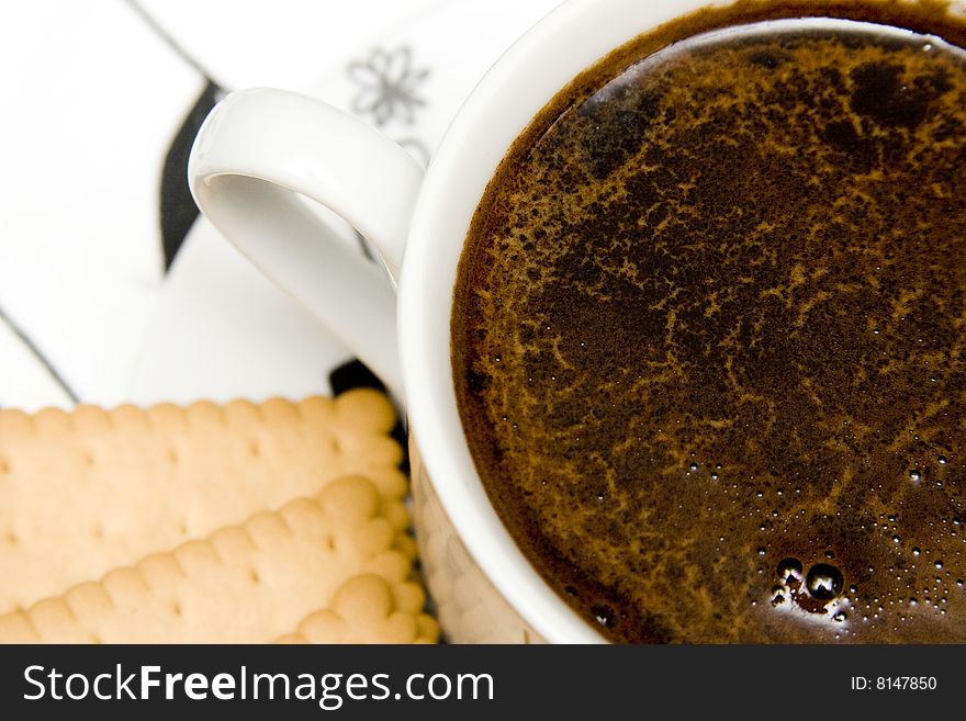 Cup of black coffe with cake