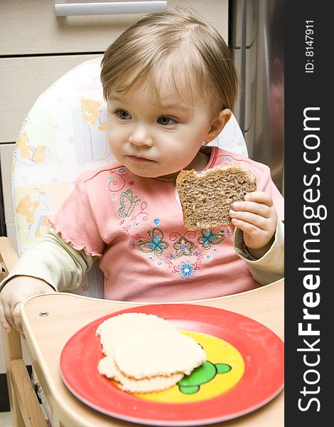 Sweet toddler baby girl eating. Sweet toddler baby girl eating