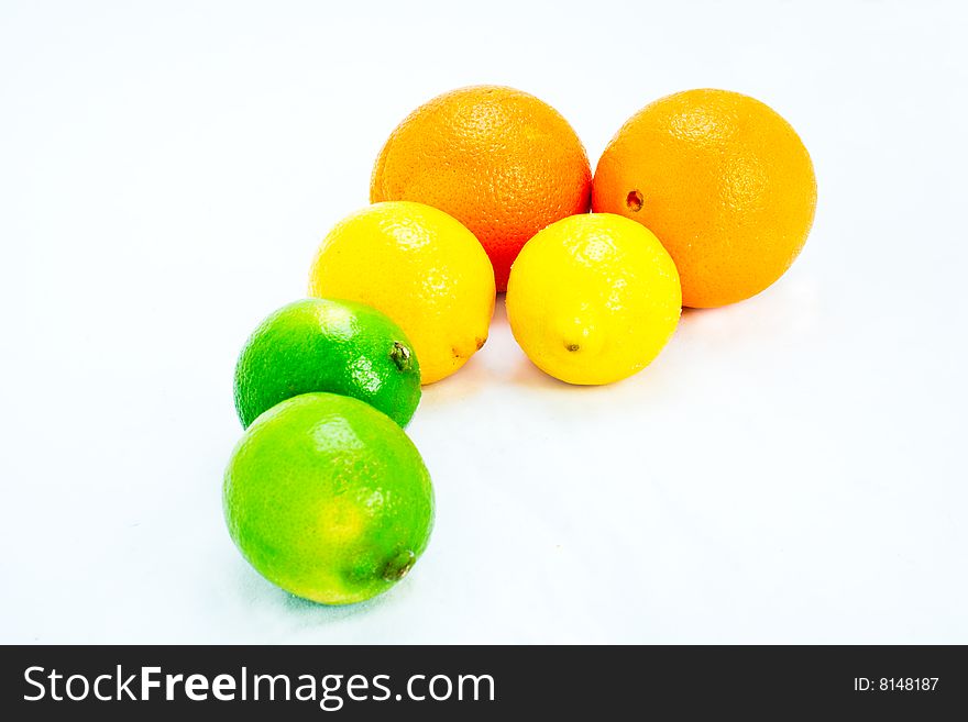 A collection of citrus fruit isolated on white. A collection of citrus fruit isolated on white