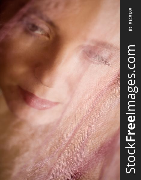Stock photo: an image of a woman's face under the vail. Stock photo: an image of a woman's face under the vail