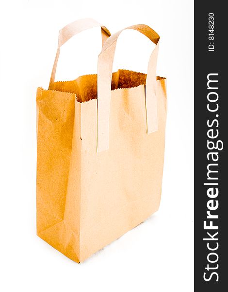A single empty paper bag isolated on white. A single empty paper bag isolated on white