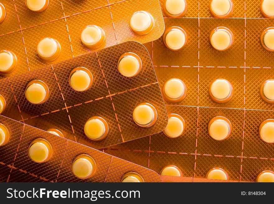 Stock photo: health theme: an image of orange pills closeup