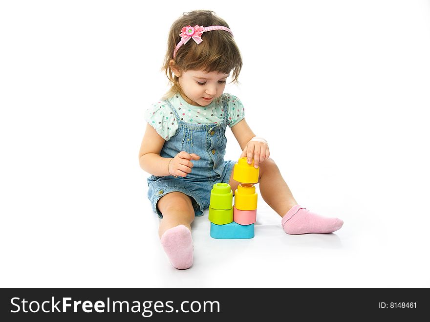 Cute One Year Old Girl Making A Pyramid