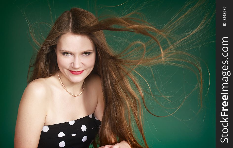 Beautiful woman with waving long red hair