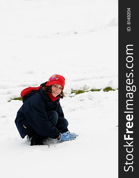 Portrait of girl playing in the snow