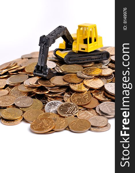 Yellow Excavator On A Big Heap Of Coins