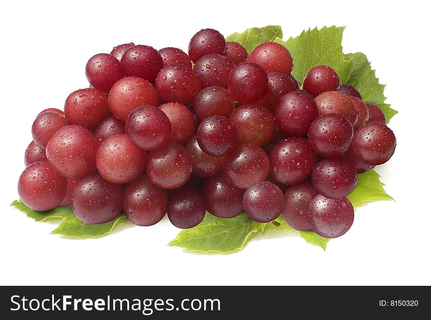 Red grapes on top of leaf