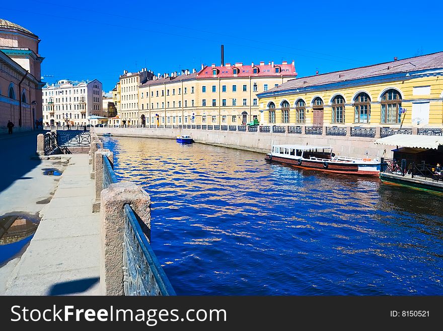 Blue water of a canal in Saint Petersburg, Russia, spring