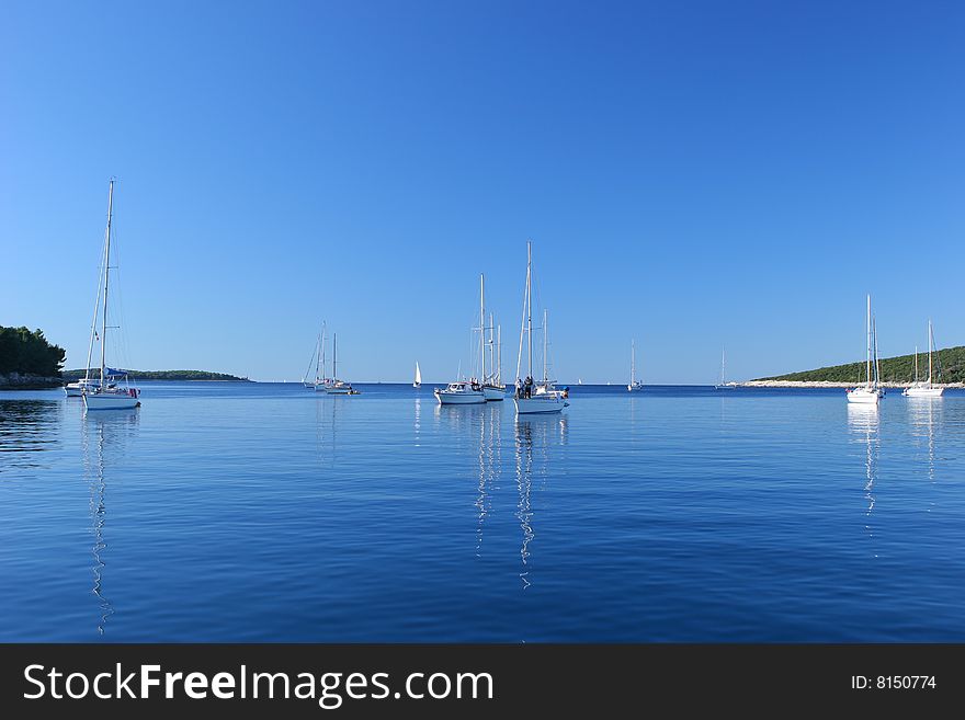 Sailing boats mooring at Croatian Islands