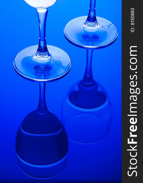 Blue Glass with Splashing water. Coolness Drink