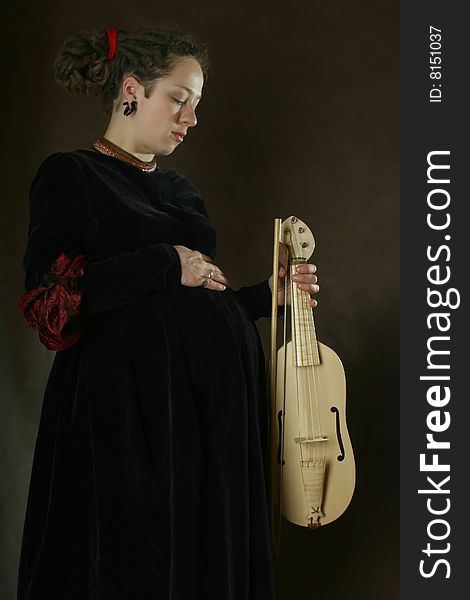 Pregnant Woman With A White Fiddle