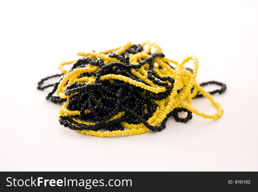 Wreathed black and yellow beads dressed in a thread