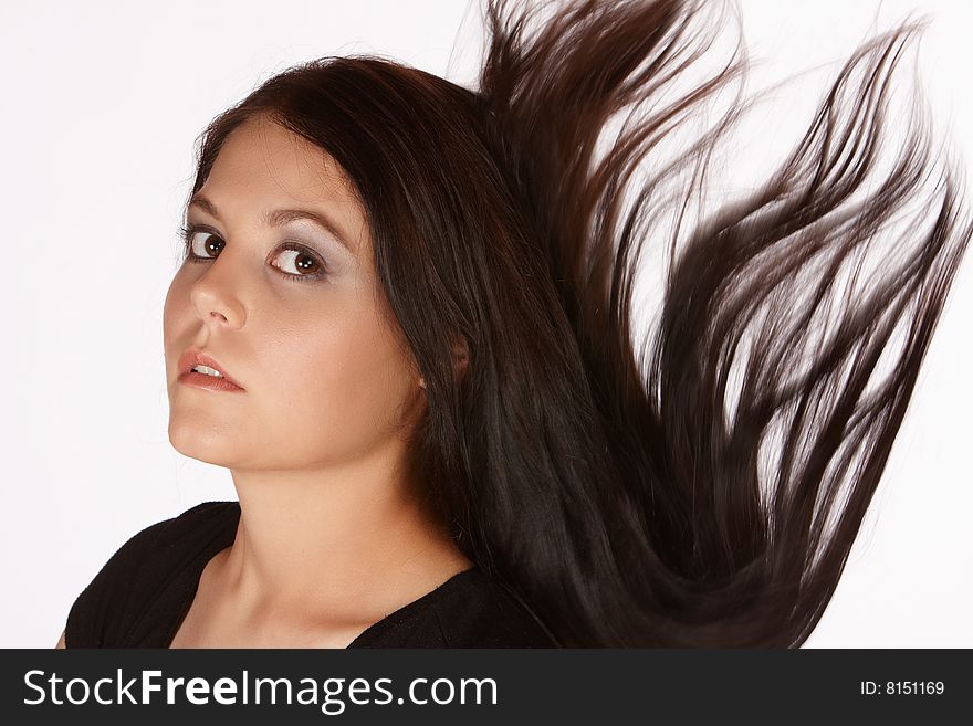 Young female with long hair falling behind her. Young female with long hair falling behind her