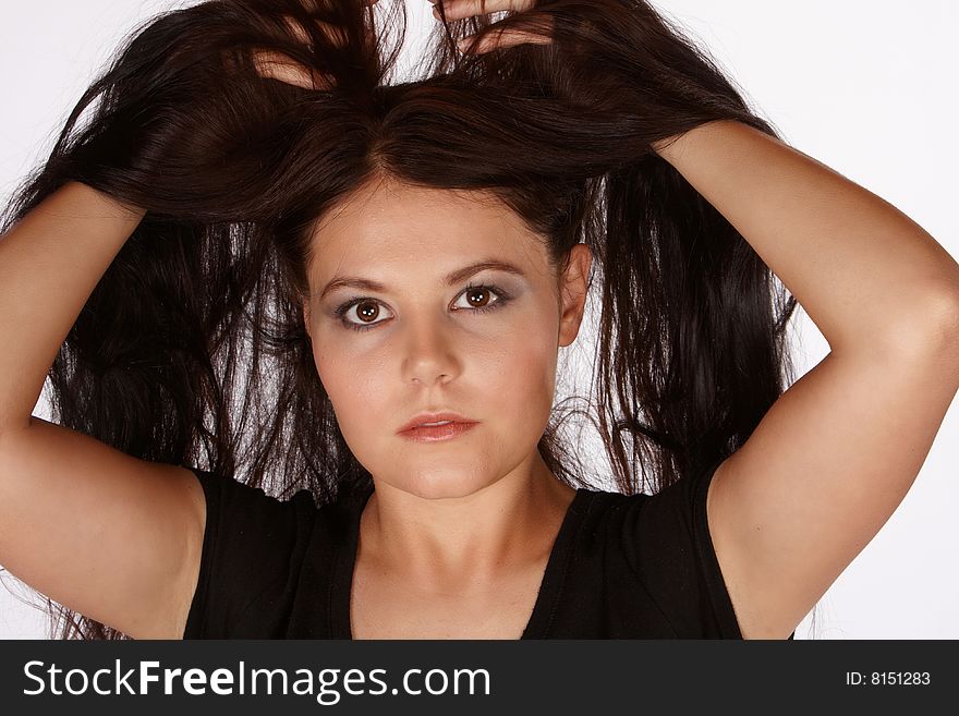 Young attractive female lifting her hair above her haid. Young attractive female lifting her hair above her haid