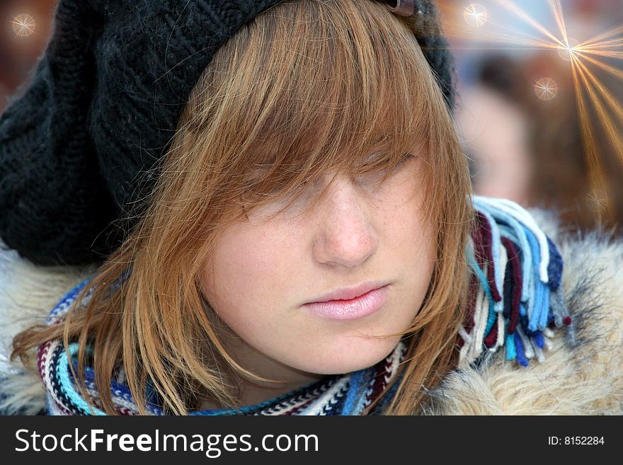 The young girl with the black hat looked wistfully. The young girl with the black hat looked wistfully.